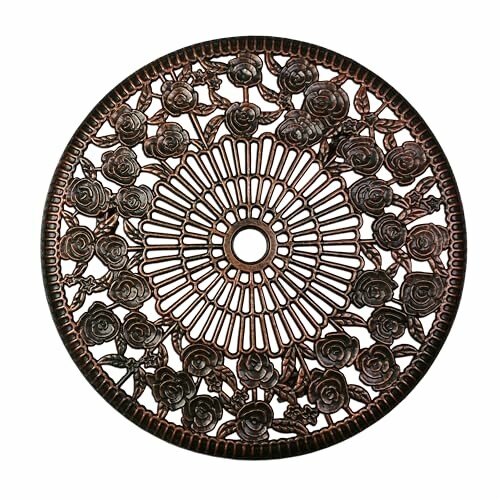 Ornate circular metal design with rose pattern.