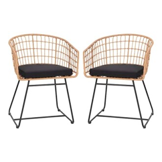 Two wicker chairs with black cushions and metal legs.