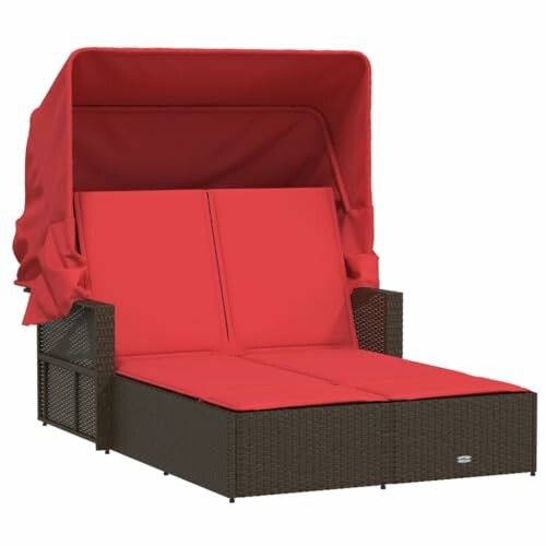 Wicker daybed with red cushions and canopy