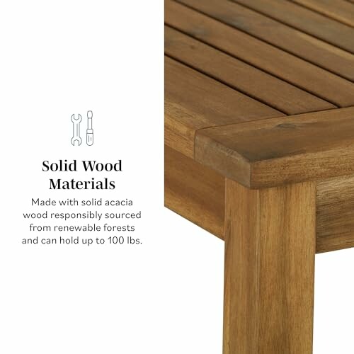 Corner of a solid wood table with text about material and weight capacity.