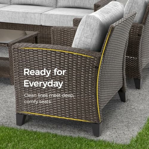 Wicker patio furniture with cushions on a patio.