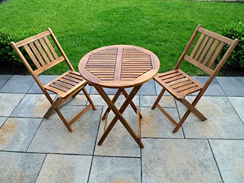 Wooden patio set with two chairs and a round table on a stone patio.