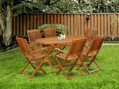 Wooden patio table with six chairs on grass